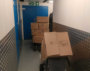 Boxes being moved around a corridor