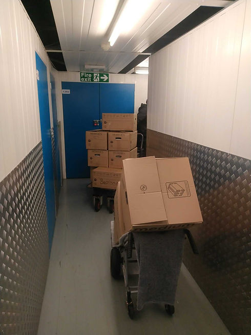 Boxes being moved around a corridor