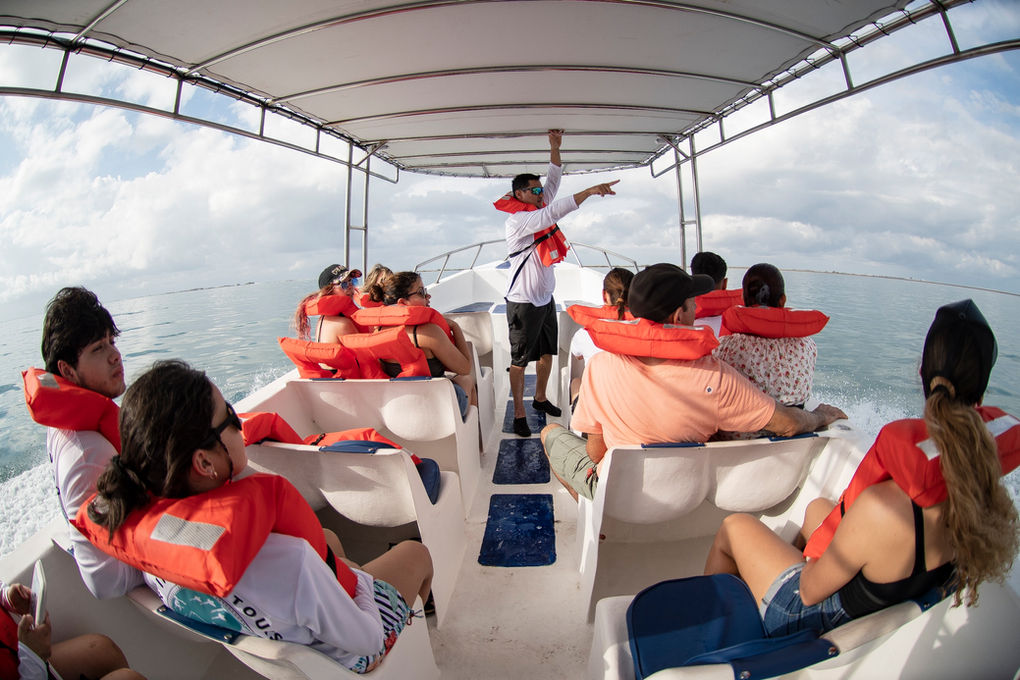 Photo of a staff member pointing to something in the distance.