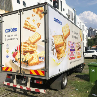 Colorful lorry sticker showcasing food product branding with neat sticker lorry installation for visual marketing