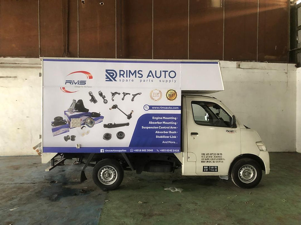 White lorry with detailed spare parts visuals and corporate branding, representing clean and informative lorry sticker design with professional sticker lori installation service.
