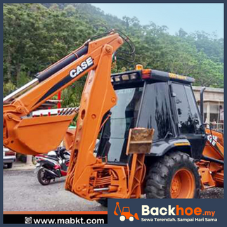 Backhoe loader digunakan untuk kerja pengorekan tanah projek kecil.