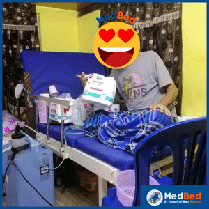 Automatic hospital bed with raised backrest for a more comfortable sitting position.