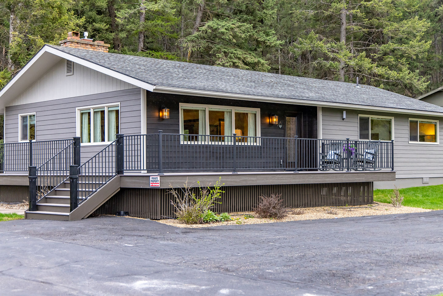 Somers House, a gray three-bedroom home with a deck, in the town of Somers