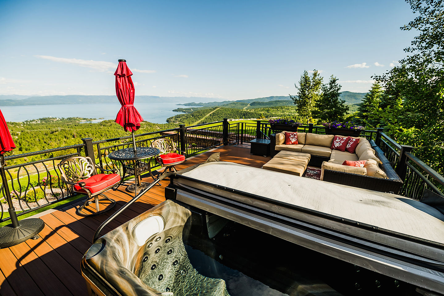 A private hot tub on a suite deck, the lake beyond