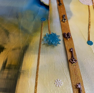 Detail 10: Sewn into the golden ribbon are 6 skelton keys, one set of lungs, and , weaving up and down, 4 sizes of polymer mandalas set in resin, and one flower set in blue resin.
Skeleton Key: Skeleton keys symbolize “access to” something, whether it be abstract, as in keys to a city, or actual, keys to your home. They are often thought to symbolize the key to one's heart, the key to success, or the key to “unlocking the door” to whatever it is one wishes to attain.
In this case, the keys represent the date as well as a representation of having "The People's Home" violated.