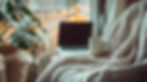 cozy-nook-with-laptop-coffee-mug-wool-blanket.jpg