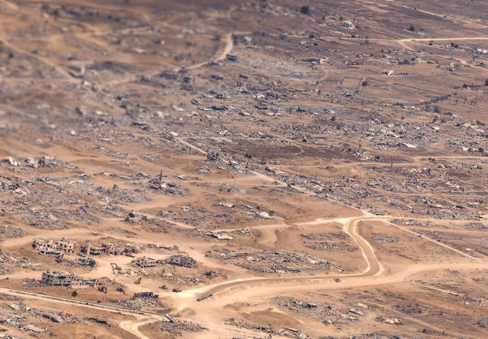 An aerial view from a Jordanian Air Force plane that was airdropping aid packages that shows the rubble of destroyed buildings in the Gaza Strip, July 31, 2025. Israel has sought to push back against its growing isolation over starvation in Gaza by allowing some private businesses to import goods into the enclave again, as well as calling for a U.N. Security Council meeting to discuss the plight of hostages. (Diego Ibarra Sánchez/The New York Times)