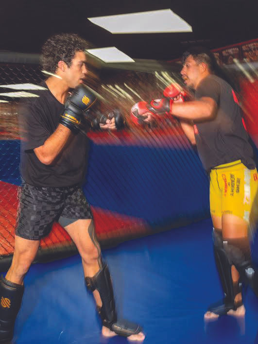 Payton Talbott, left, a rising star in the Ultimate Fighting Championship (UFC), the largest organization for the sport of mixed martial arts in the world, trains at the Reno Academy of Combat, in Reno, Nev., July 31, 2025. What happens when the Ultimate Fighting Championship’s hottest prospect doesn’t fit the sport’s hypermasculine mold? (Emily Najera/The New York Times)