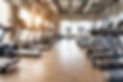 Bokeh background. Abstract blur and defocused fitness sport equipment in gym room interior