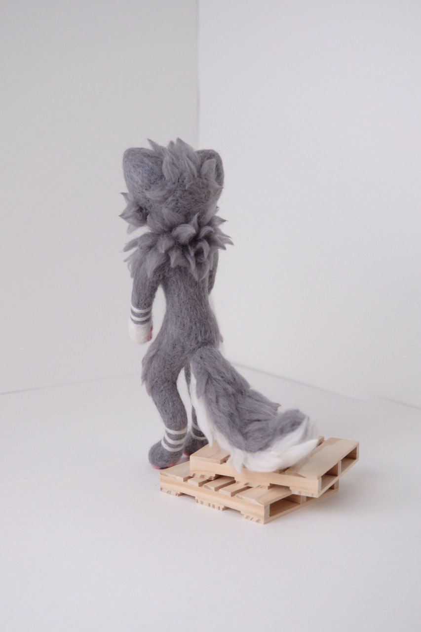 back view showing the tail and back fur fluff of the grey and white cat furry art doll