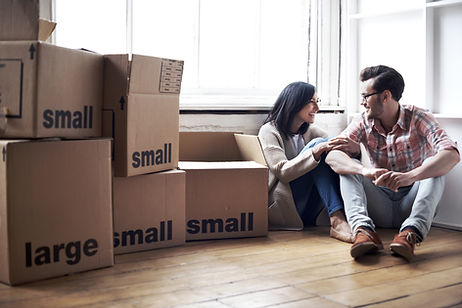 Couple preparing to pack and label items