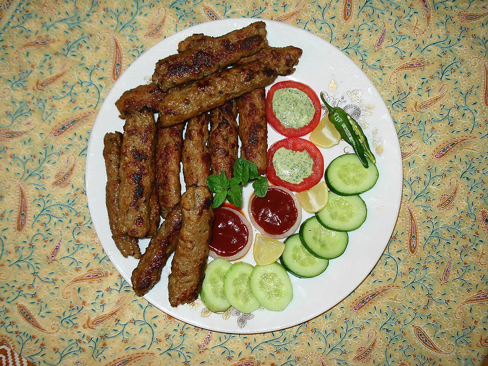 Seekh kabab served with salad and chutney.