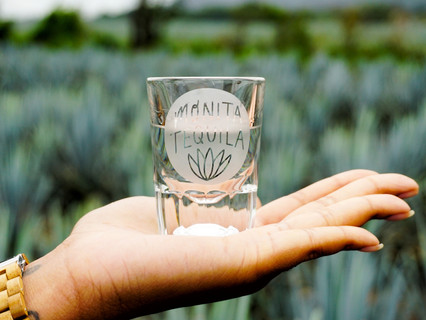 Monita Tequila Shot Glass Held by Creator Serita Braxton