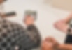 people using a calculator during a real estate transaction