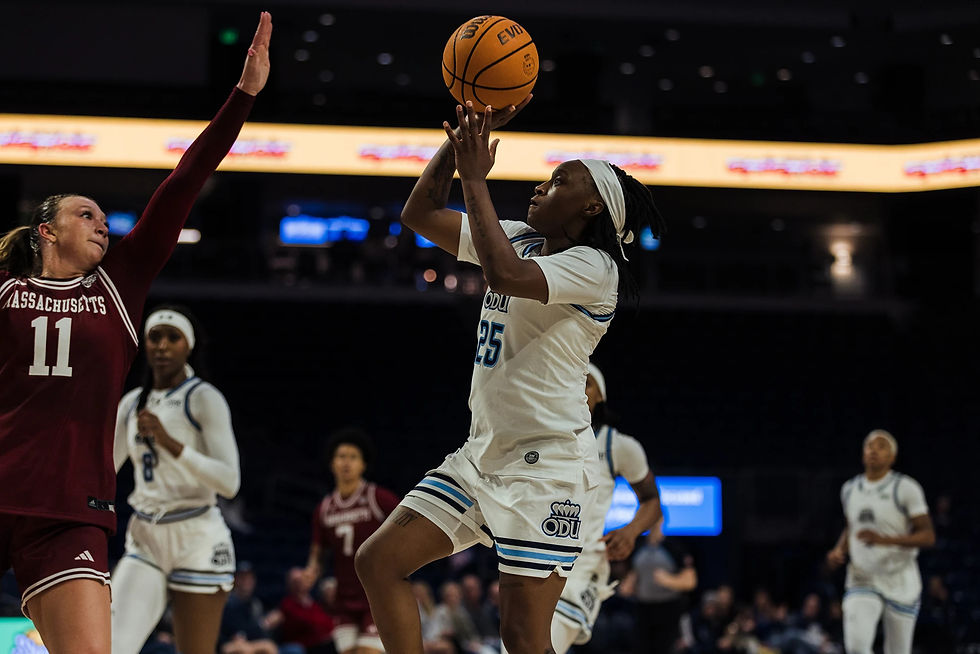 ODU Women's Basketball player shoots a floater over the opposing team.