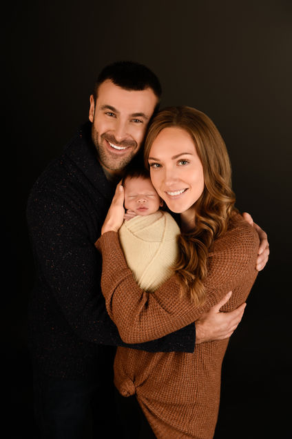 Studio newborn session Ottawa with parents and baby in soft tones