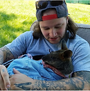 a man holds a baby wallaby in germantown, maryland