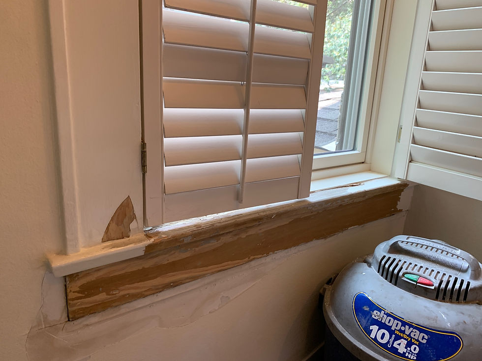 Before: damaged stairwell window frame