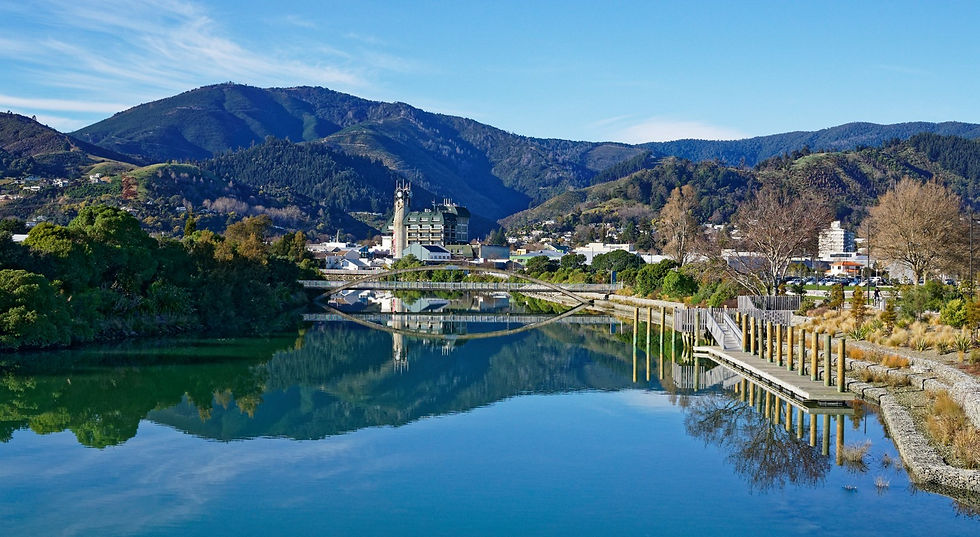 Panorama of Nelson City, reflected in the Maitai River, New Zealand.