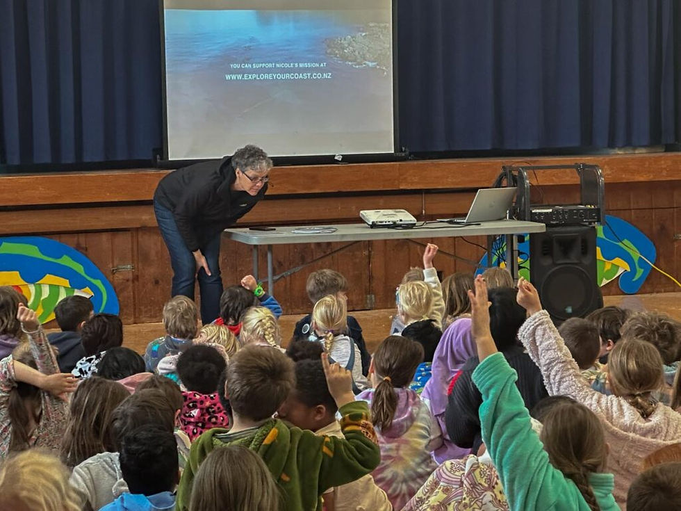 Dr Nicole Miller speaking with primary school students during an Explore Your Coast marine education session.