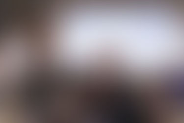 Audience raising hands during a public consultation meeting, representing community engagement in the Draft NZ Curriculum 2026 consultation process.