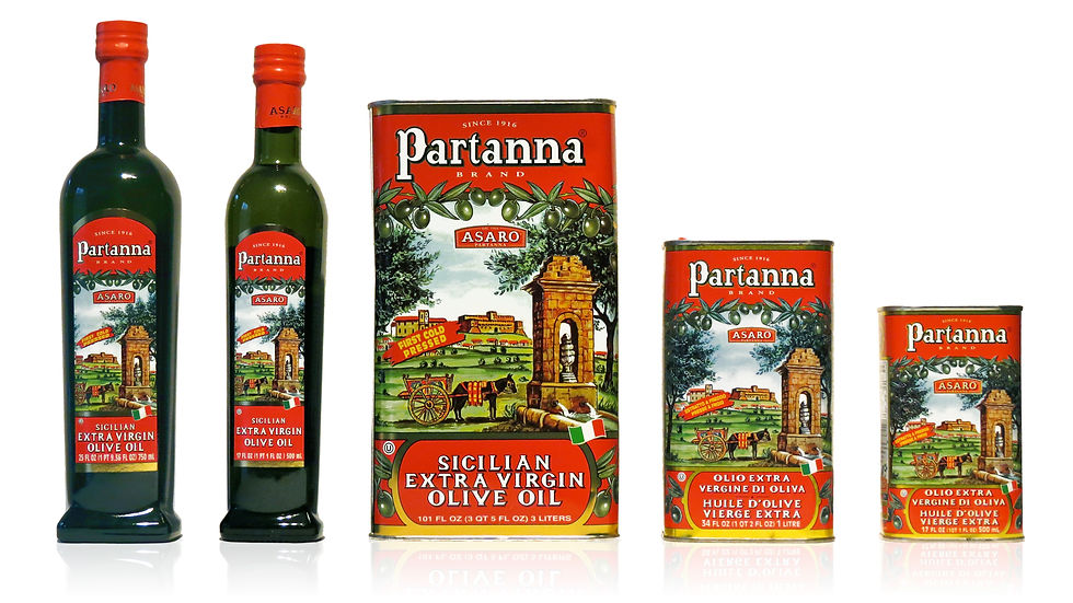 Close-up view of a bottle of Partanna olive oil with fresh olives