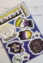 Nonbinary sticker sheet on top of a planner page.