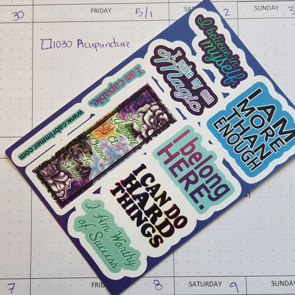 Image of affirmation sticker sheet laying across a planner page.