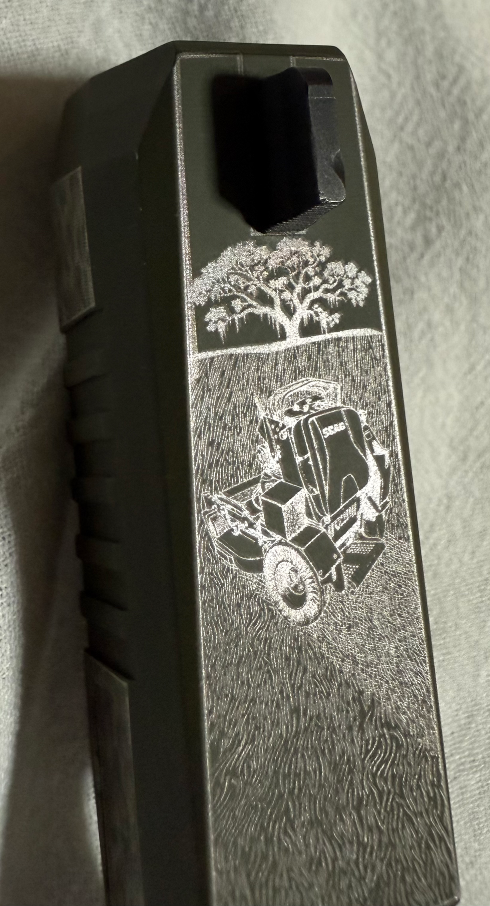 Laser engraved gun slide