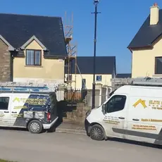 Vans outside a building