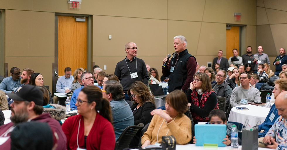 Midwest real estate investors participate in a live audience Q&A during a conference session.