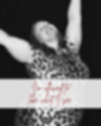 Joyful black-and-white portrait of Amanda wearing a leopard-print dress with her arms raised beneath the words “I’m allowed to like what I see.”
