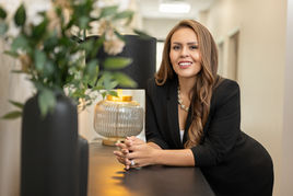 Office lifestyle branding image of Roxanne Theodoropoulos for CapstoneWealth marketing content