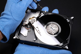 hands-with-gloves-repairing-hard-drive-high-angle.jpg