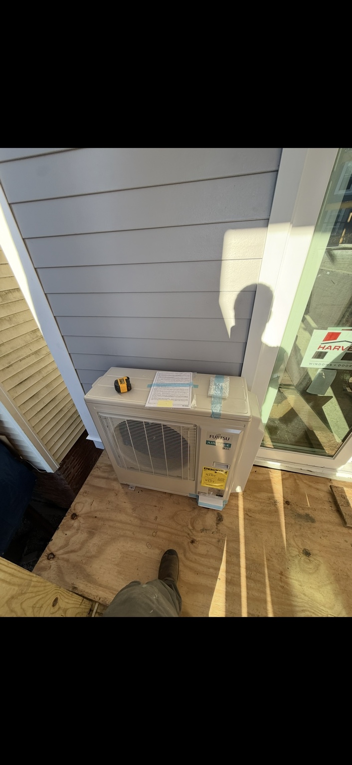 Fujitsu Airstage outdoor unit positioned at a construction site