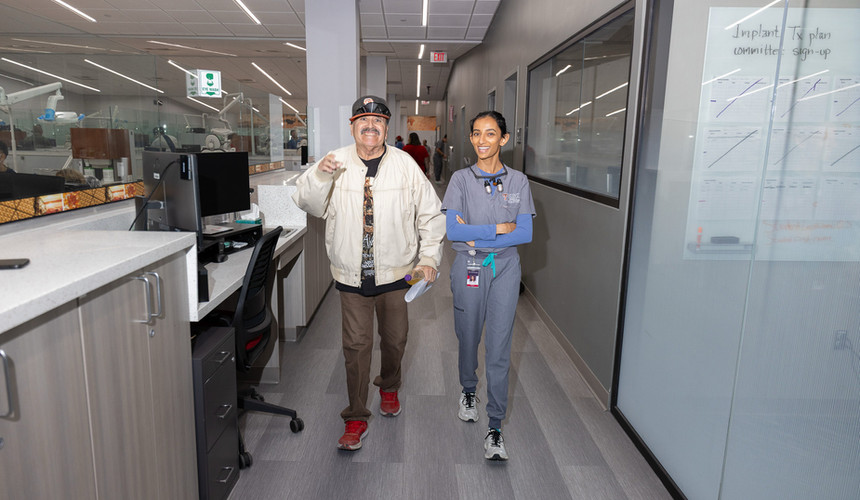 Screen & Clean patient walking to Dental cleaning with Texas Tech Dental Student