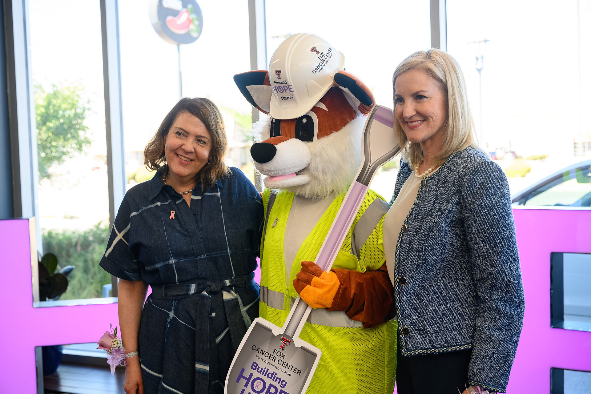 Attendees pose with fox mascot at Group 1 Subaru El Paso