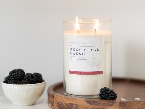 Hand-poured Natura Soy Candle with a vibrant scent, showcasing eco-friendly packaging and a warm, inviting glow.