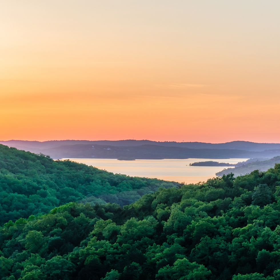sunset at a lake in Ozark National Forest
