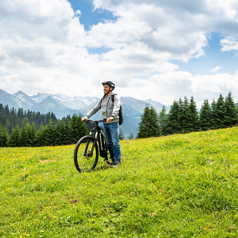 mountain biker adminering the peaks of the mountains surrounding Portland Maine
