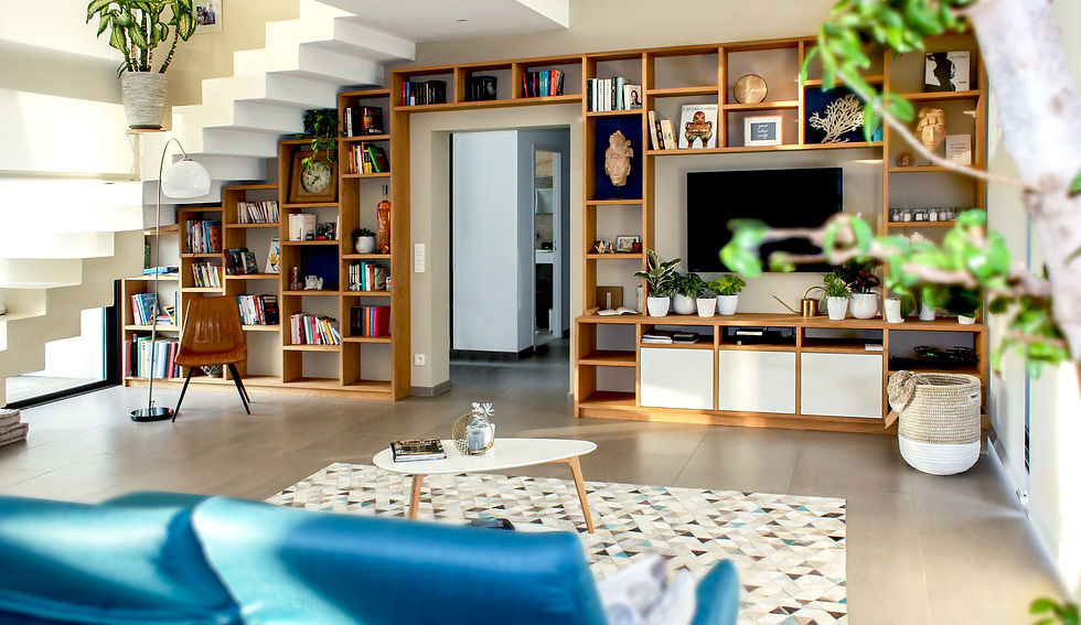 Wall to wall shelving featuring under stair shelving