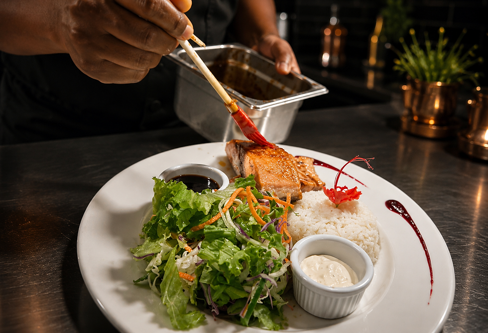 Chef brushing glaze on salmon at a steakhouse Costa Rica.