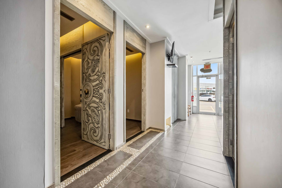 Modern Zen spa interior with clean lines, neutral colors, and a peaceful vibe.