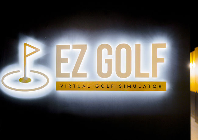Clean and well-lit hallway at EZ Golf Aurora