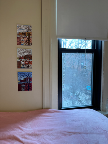 drawings next to a window