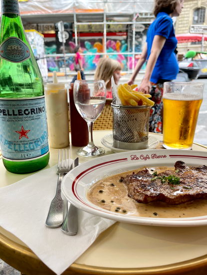 Photo of steak and frites dinner at cafe in Paris