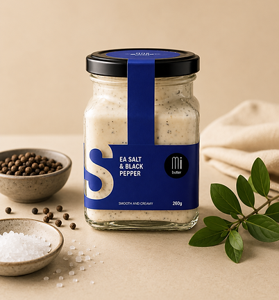 Sea salt with black pepper in a jar with blue label.