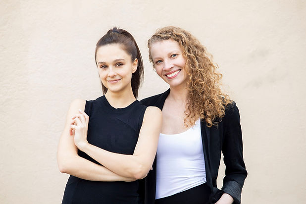 Lauren Lovette in a black tank shirt and Lauren King in a black blazer and white top