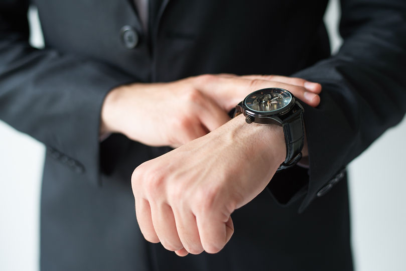 businessman-consulting-wristwatch.jpg